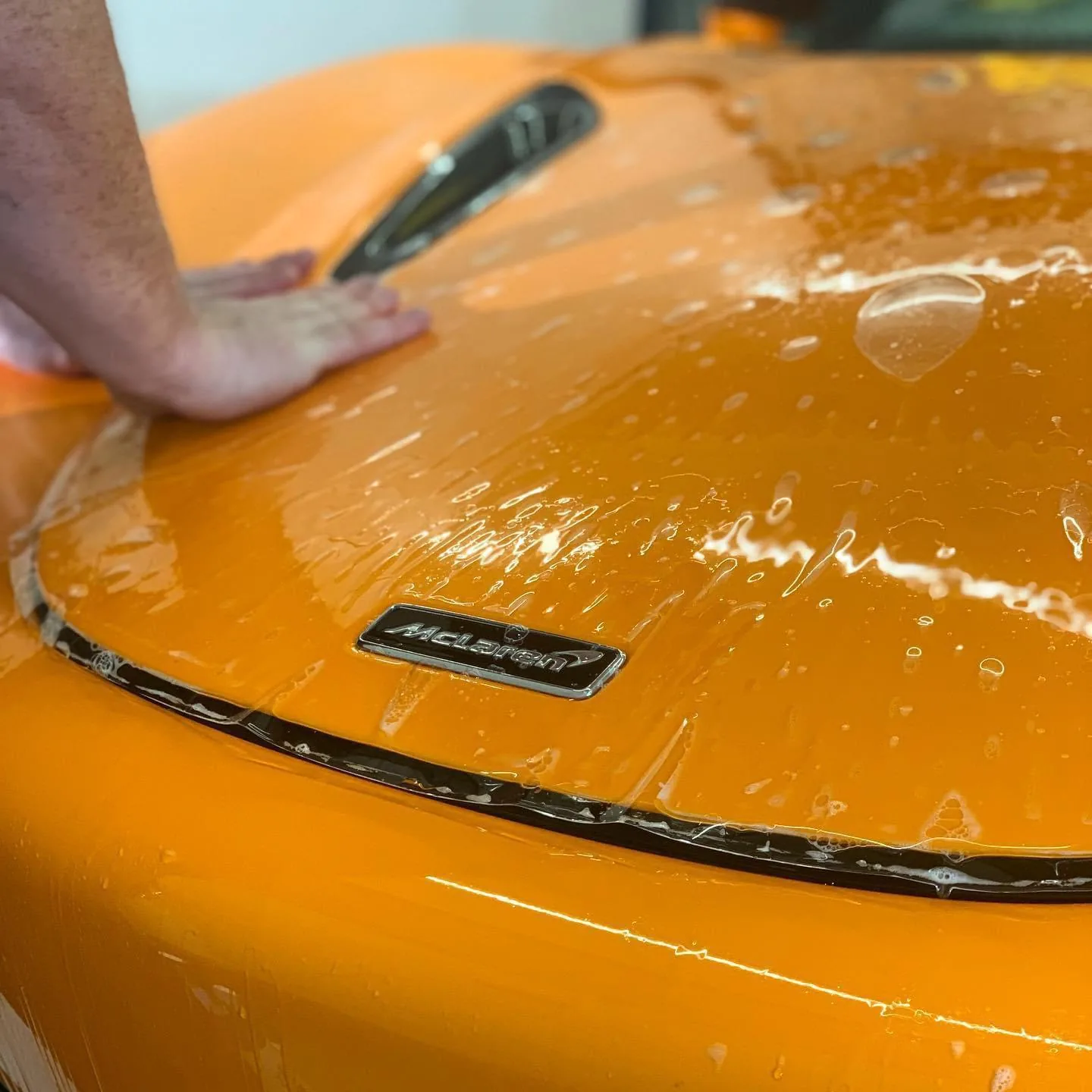 Paint protection film being fitted in the studio