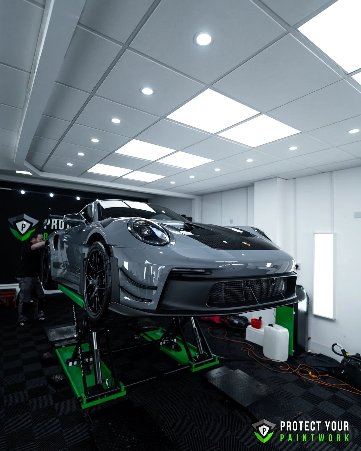 A Porsche GT3 RS on the lift in the studio